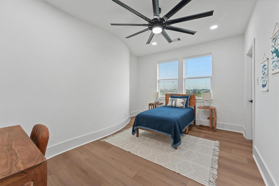 One of several guest bedrooms, each designed with large windows, ceiling fans, and easy access to beautifully finished bathrooms. One of several guest bedrooms, each designed with large windows, ceiling fans, and easy access to beautifully finished bathrooms.