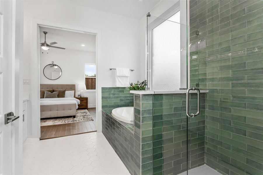 Bathroom featuring shower with separate bathtub, tile patterned flooring, and ceiling fan