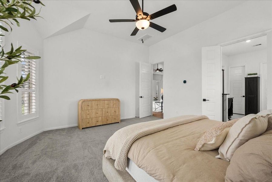 The primary bedroom offers breathtaking water views from every window and features a private spa-like en-suite bath designed for relaxation.