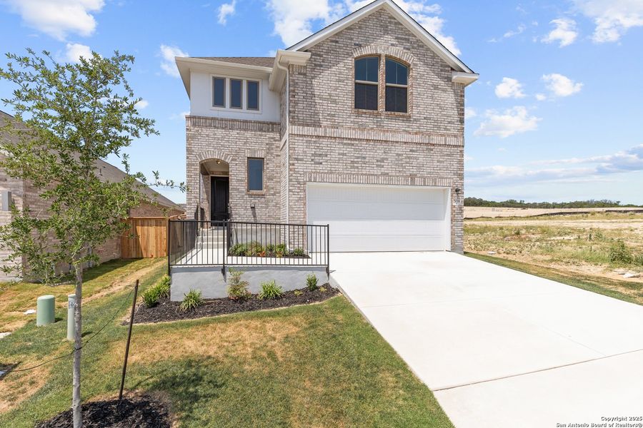 Front exterior of a new home in Ladera, San Antonio, TX, highlighting curb appeal (Image 2). Front exterior of a new home in Ladera, San Antonio, TX, highlighting curb appeal (Image 2).