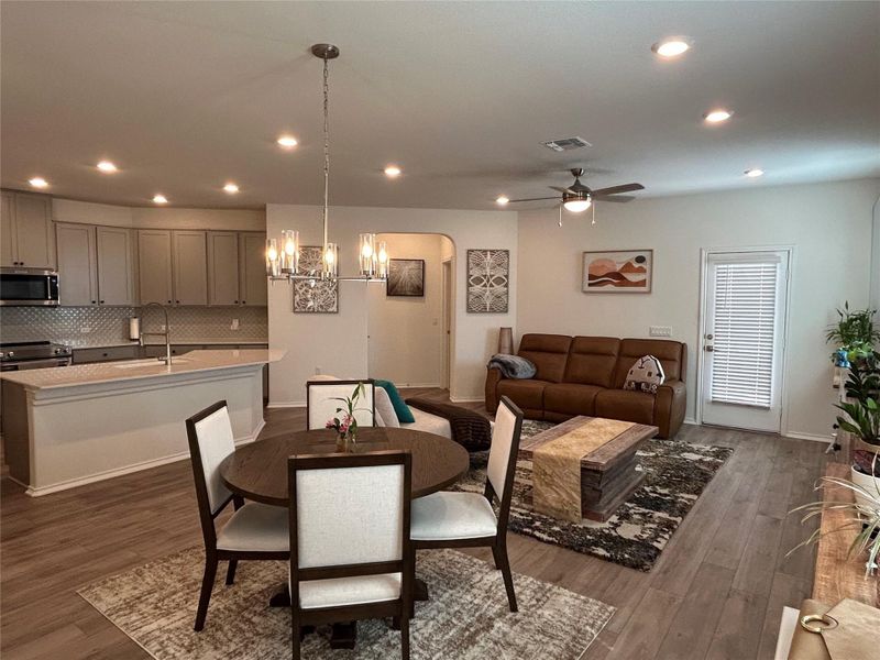 Living/Dining room with a chandelier, and recessed lighting. Open to the kitchen for easy entertaining. Living/Dining room with a chandelier, and recessed lighting. Open to the kitchen for easy entertaining.