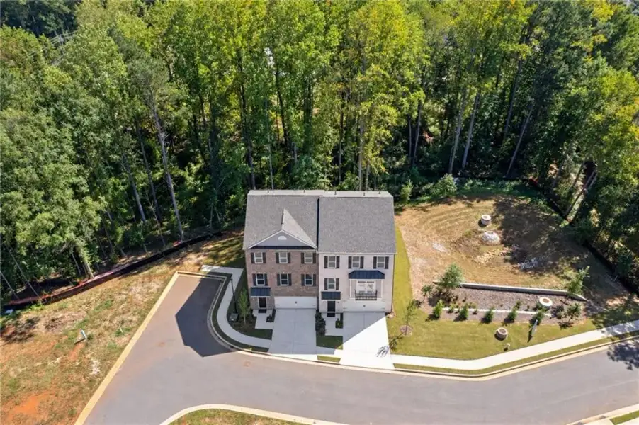 Front exterior of a new home in , Suwanee, GA, highlighting curb appeal (Image 17).