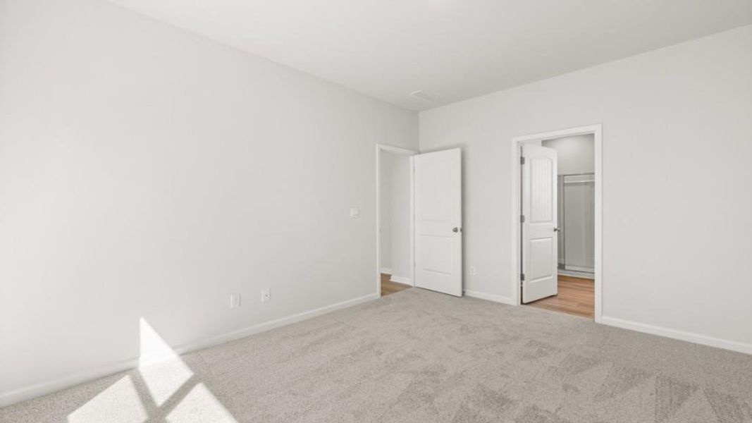 Spacious, unfurnished interior of a new home in South Wind, Fairburn (Image 28).