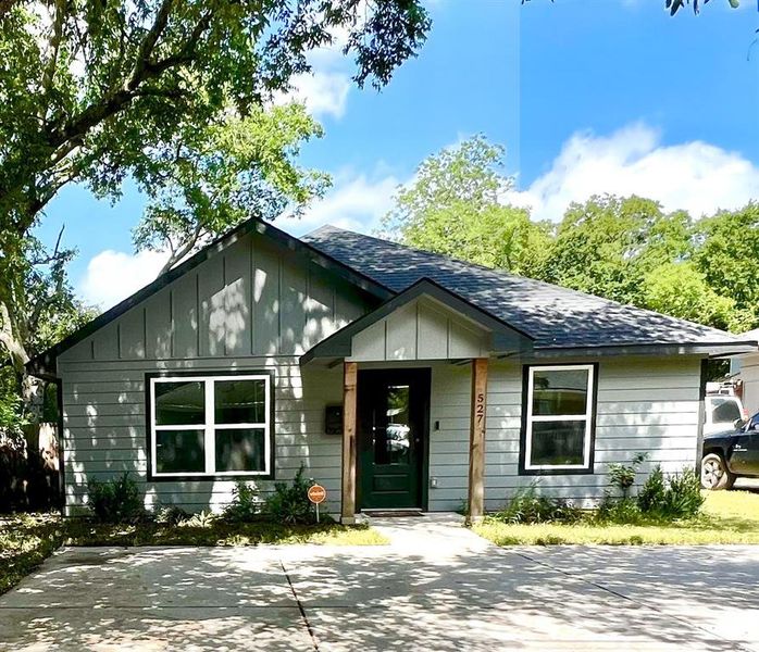 View of front of property with board and batten siding and a shingled roof View of front of property with board and batten siding and a shingled roof