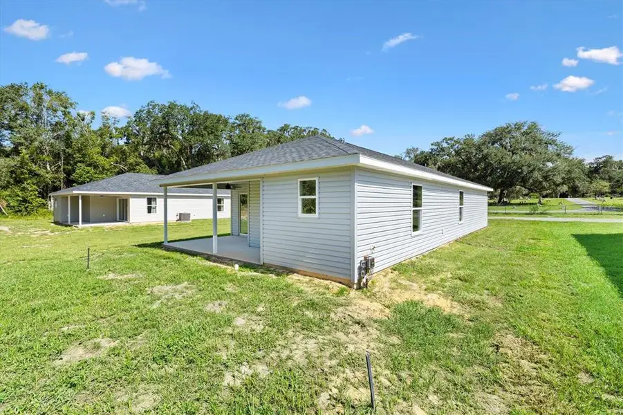 Exterior details and patio area of a home in , Bushnell (Image 4).