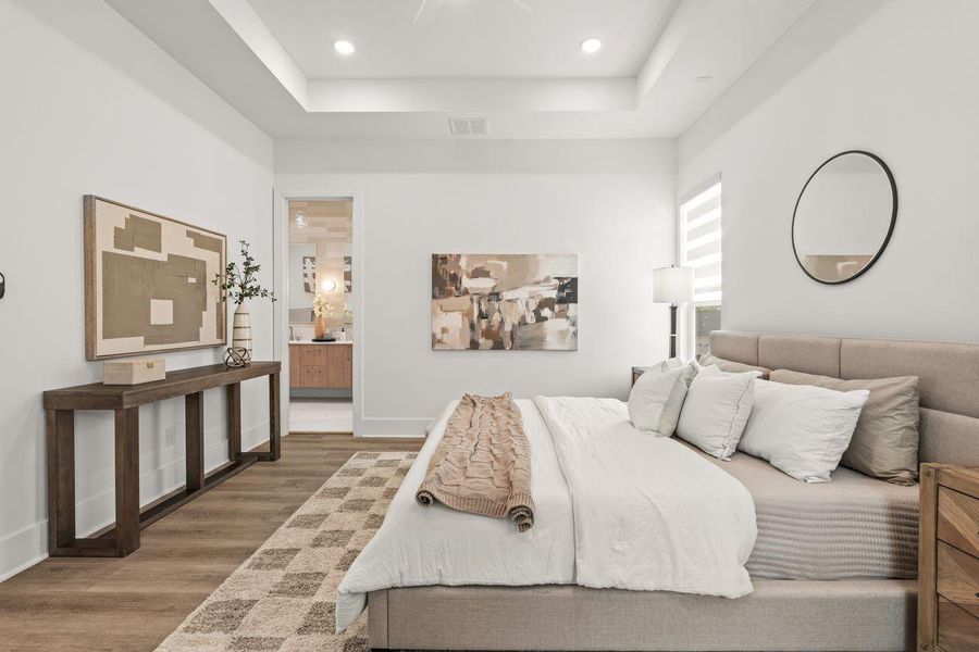 More than a single room, the primary suite was envisioned as a collection of spaces that work together effortlessly. The transition between the bedroom and bath feels intuitive and unhurried, reinforcing the home's emphasis on comfort and ease of living.