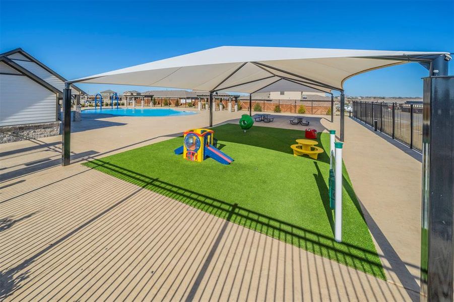 View of home's community featuring a patio area, a pool, and a playground