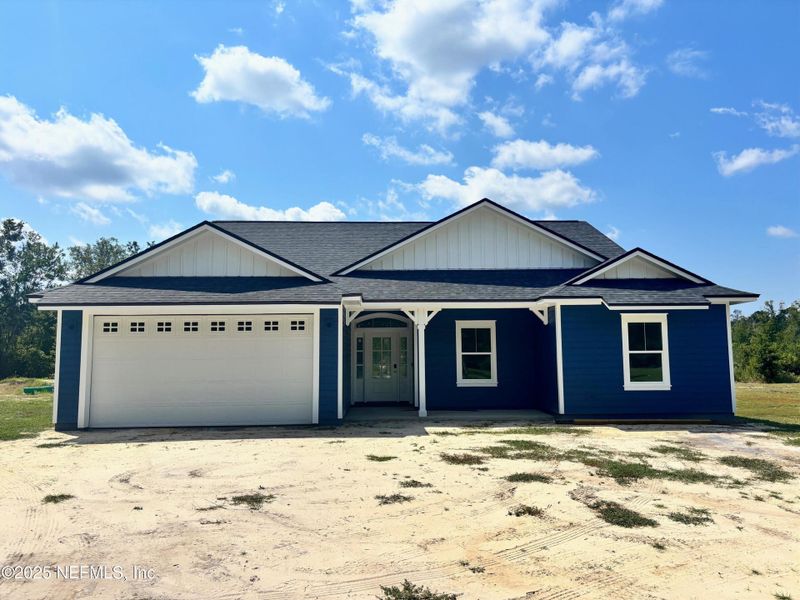 Front exterior of a new home in , Melrose, FL, highlighting curb appeal (Image 1).