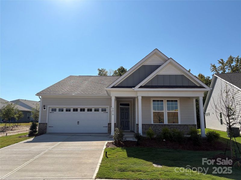 Front exterior of a new home in Cottages at Wingate, Wingate, NC, highlighting curb appeal (Image 1).