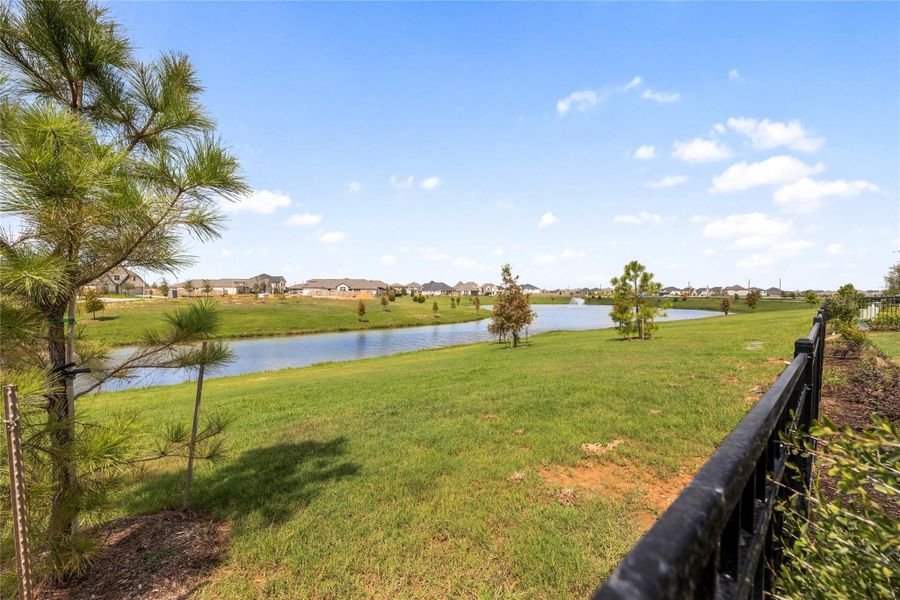 Breathtaking panoramic views of the community lake directly from the home's rear fence line. This premium lot position offers an expansive view of the winding water feature and manicured community greenways, establishing a peaceful, park-like setting right outside your back door. Breathtaking panoramic views of the community lake directly from the home's rear fence line. This premium lot position offers an expansive view of the winding water feature and manicured community greenways, establishing a peaceful, park-like setting right outside your back door.
