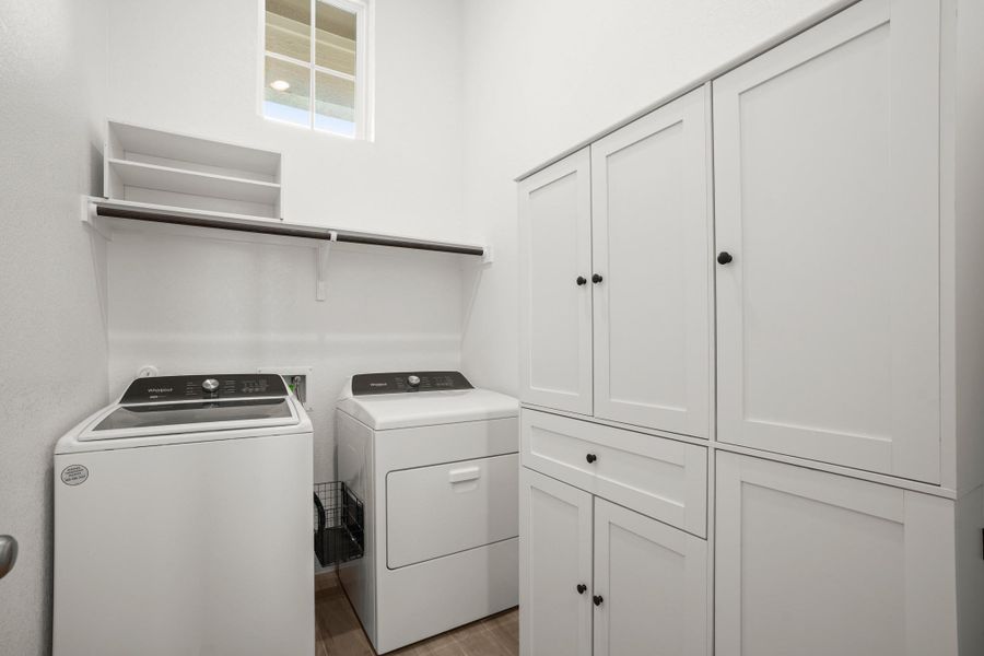 A well-organized laundry area offers both convenience and ample storage solutions.