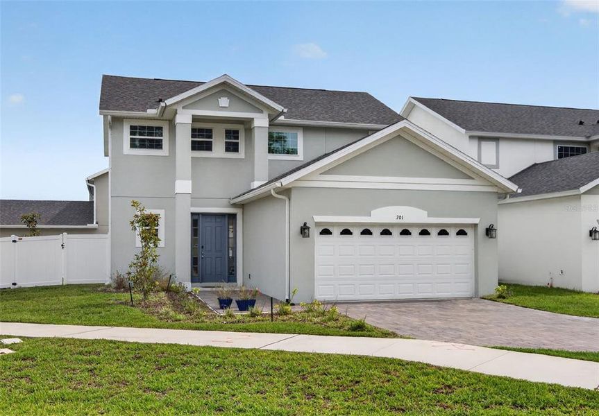 Front exterior of a new home in Blue Diamond , Orlando, FL, highlighting curb appeal (Image 1). Front exterior of a new home in Blue Diamond , Orlando, FL, highlighting curb appeal (Image 1).