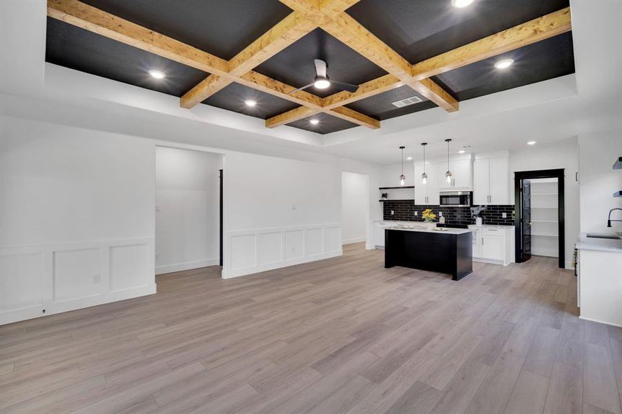 Open living space with dining area and kitchen.