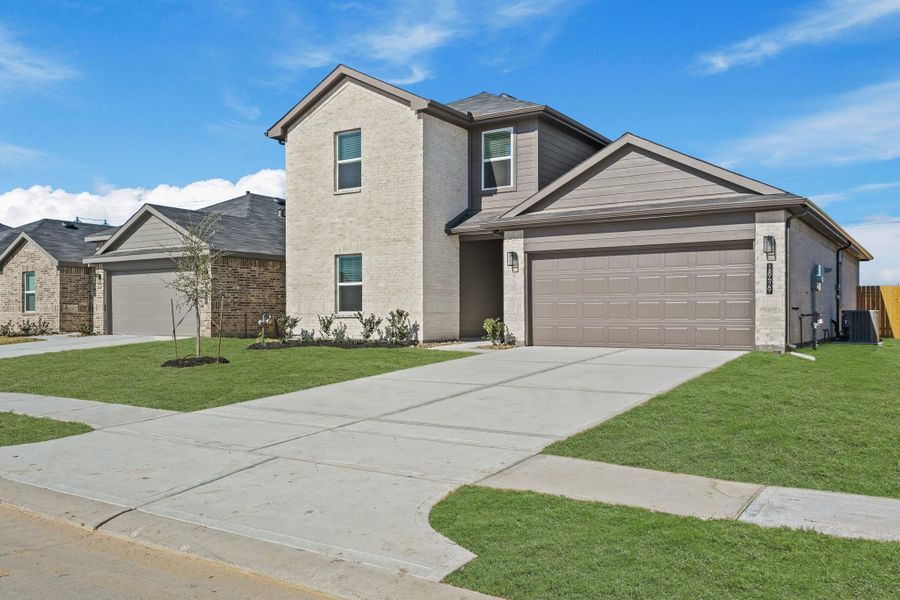 Front exterior of a new home in Porters Mill, New Caney, TX, highlighting curb appeal (Image 14).