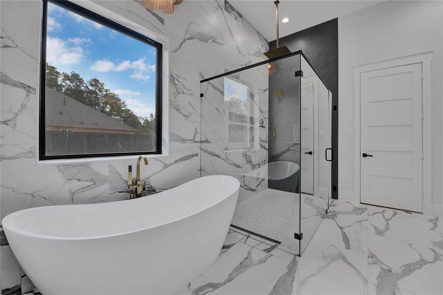 Primary Bath with tub and huge shower with seamless glass