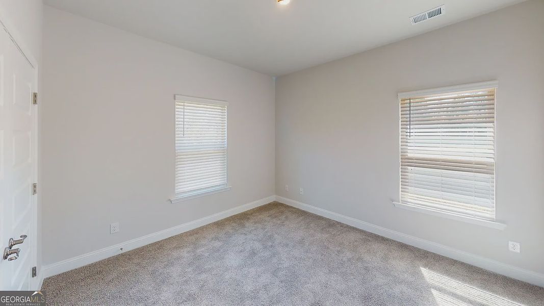 Spacious, unfurnished interior of a new home in Holliday Pass, Griffin (Image 19).