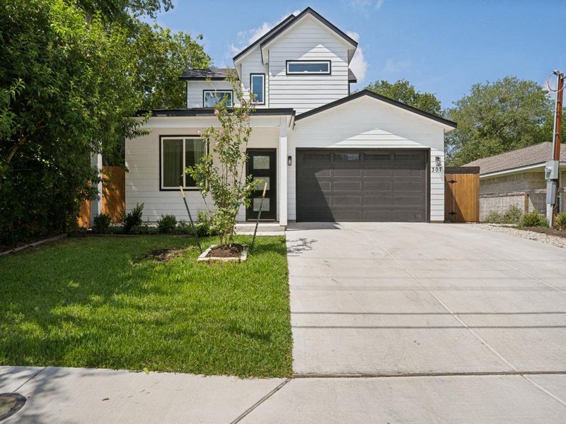 A striking modern facade with clean lines and a lush green lawn creates inviting curb appeal. A striking modern facade with clean lines and a lush green lawn creates inviting curb appeal.
