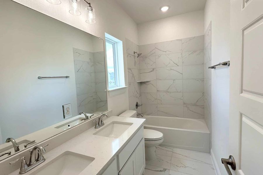 Furnished interior view inside a new home in Bluffview Reserve, Leander (Image 13).