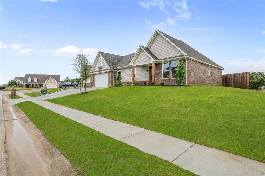 Front exterior of a new home in , Glen Rose, TX, highlighting curb appeal (Image 2). Front exterior of a new home in , Glen Rose, TX, highlighting curb appeal (Image 2).