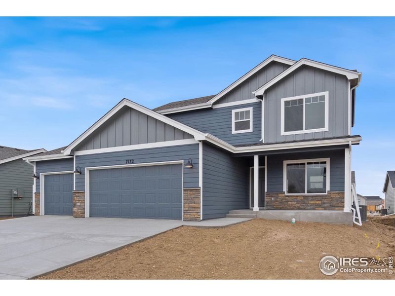 Front exterior of a new home in , Wellington, CO, highlighting curb appeal (Image 22).