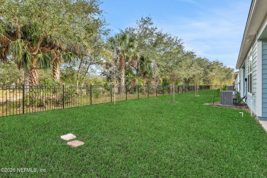 Exterior details and patio area of a home in The Hammock at Palm Harbor, Palm Coast (Image 21).