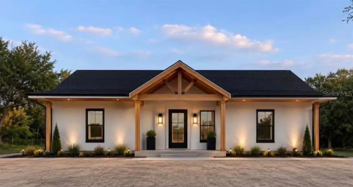 Front exterior of a new home in , Okeechobee, FL, highlighting curb appeal (Image 1). Front exterior of a new home in , Okeechobee, FL, highlighting curb appeal (Image 1).