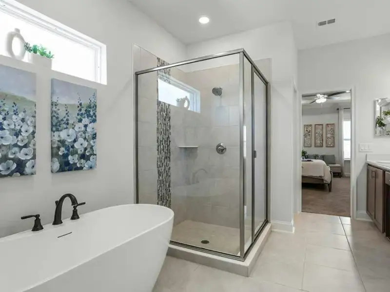 Your suite is complete with a luxurious en-suite bath, with an optional freestanding tub for an at-home spa experience - Waylyn by Highland Homes