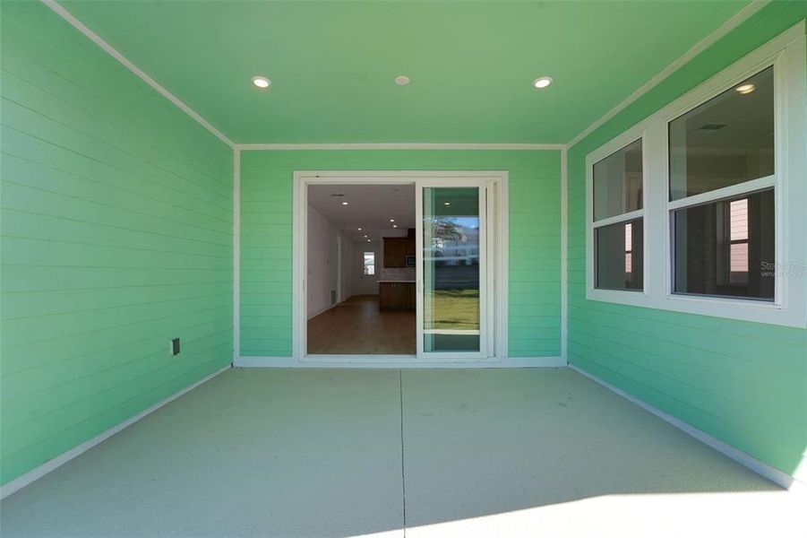 Exterior details and patio area of a home in Green Key Village, Lady Lake (Image 19).
