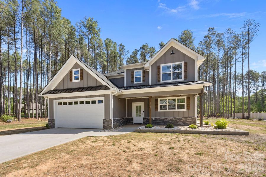 Front exterior of a new home in , Monroe, NC, highlighting curb appeal (Image 25).