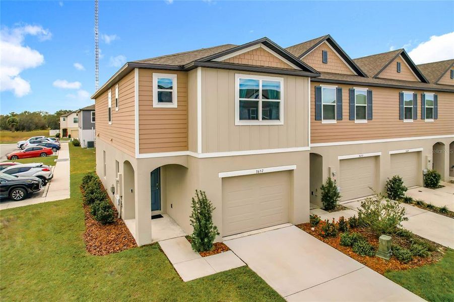 Front exterior of a new home in , Lakeland, FL, highlighting curb appeal (Image 25).