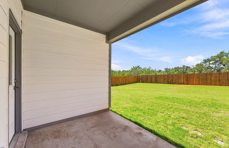 Exterior details and patio area of a home in Saddleback at Santa Rita Ranch, Liberty Hill (Image 27).