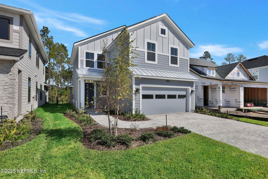 Front exterior of a new home in Crosswinds at Nocatee, Nocatee, FL, highlighting curb appeal (Image 30). Front exterior of a new home in Crosswinds at Nocatee, Nocatee, FL, highlighting curb appeal (Image 30).