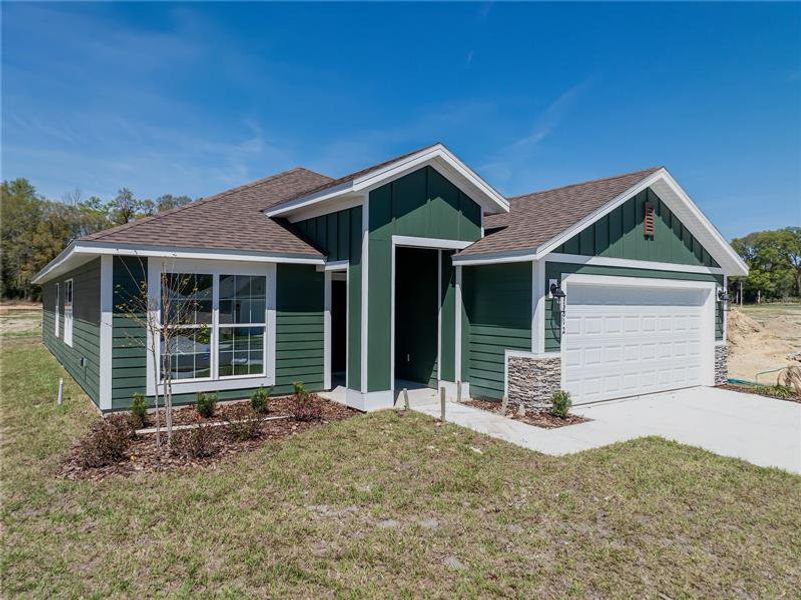 Front exterior of a new home in Briarwood, Alachua, FL, highlighting curb appeal (Image 2). Front exterior of a new home in Briarwood, Alachua, FL, highlighting curb appeal (Image 2).