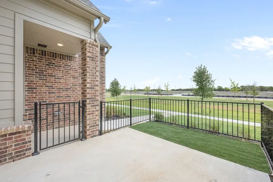 Exterior details and patio area of a home in Cottonwood Creek, Rowlett (Image 3).