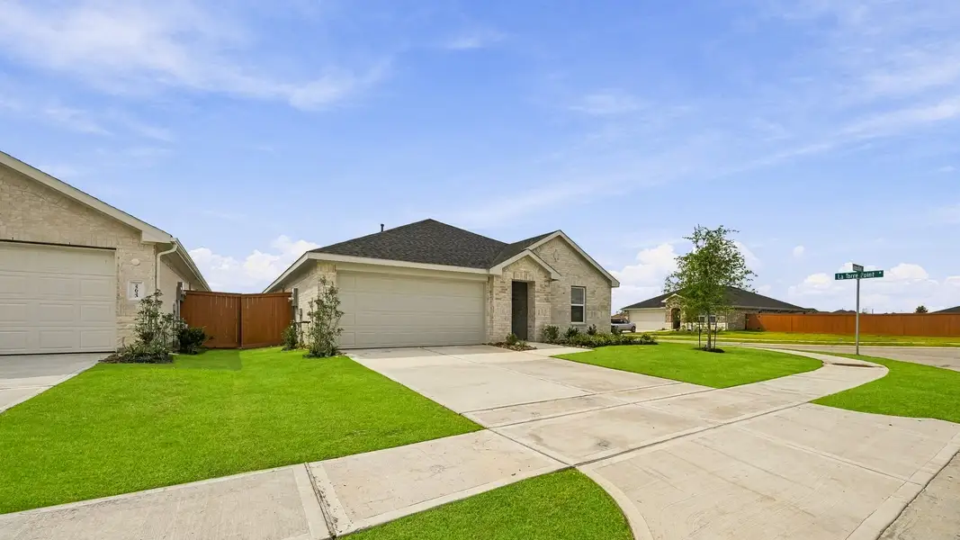Front exterior of a new home in Cypress Green, Hockley, TX, highlighting curb appeal (Image 2). Front exterior of a new home in Cypress Green, Hockley, TX, highlighting curb appeal (Image 2).