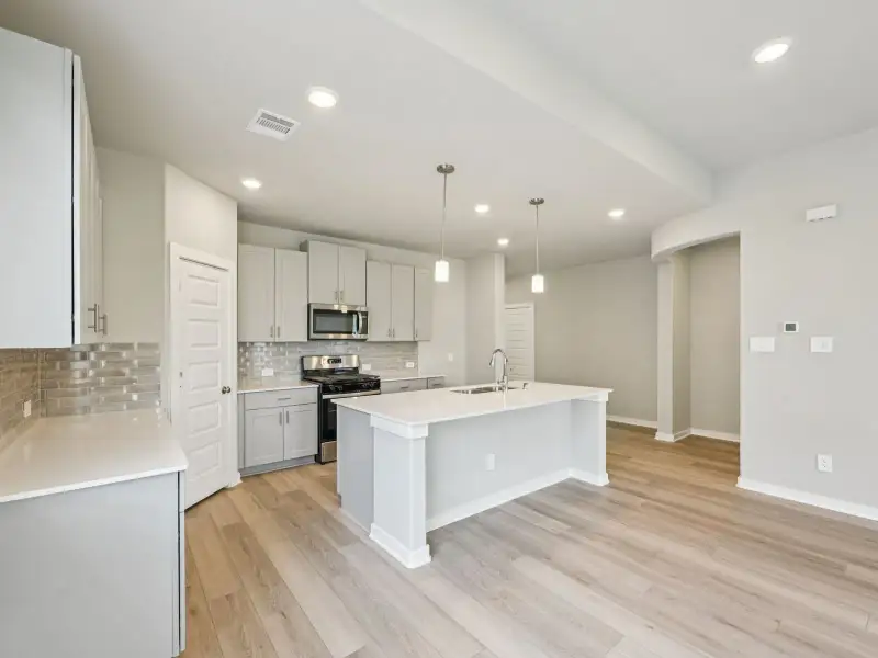 Furnished interior view inside a new home in Granger Pointe - Premier Series, Conroe (Image 6). Furnished interior view inside a new home in Granger Pointe - Premier Series, Conroe (Image 6).