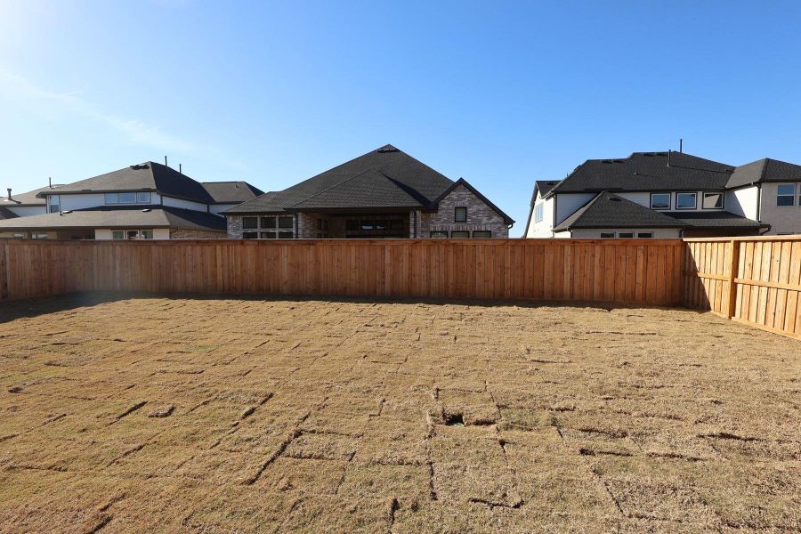 Exterior details and patio area of a home in Dunham Pointe, Cypress (Image 3). Exterior details and patio area of a home in Dunham Pointe, Cypress (Image 3).