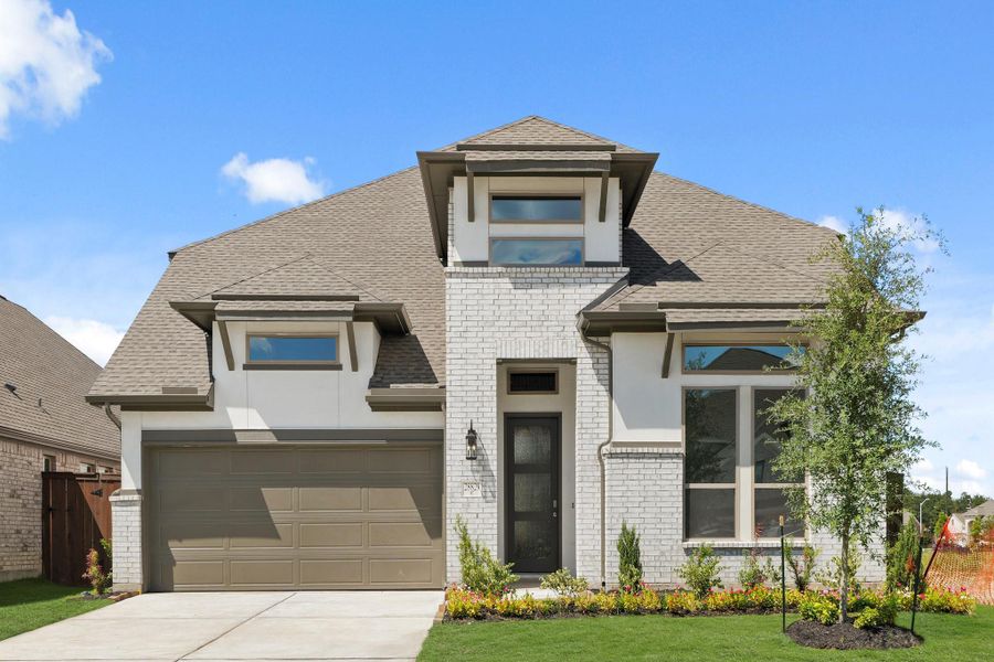 Front exterior of a new home in The Trails, New Caney, TX, highlighting curb appeal (Image 28). Front exterior of a new home in The Trails, New Caney, TX, highlighting curb appeal (Image 28).