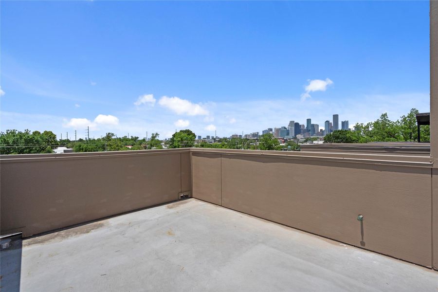 Private rooftop deck with stunning downtown skyline views, offering an incredible space for entertaining or enjoying peaceful evenings outdoors Private rooftop deck with stunning downtown skyline views, offering an incredible space for entertaining or enjoying peaceful evenings outdoors