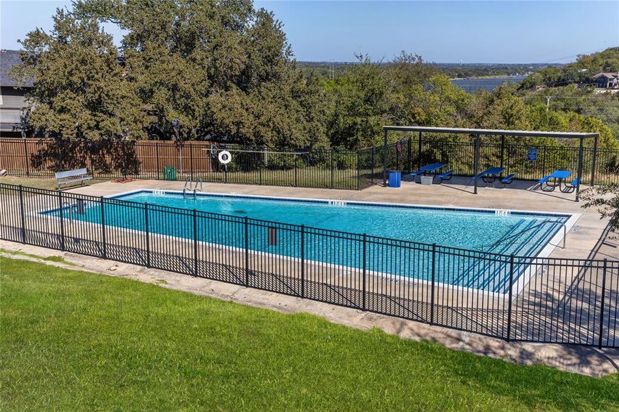 Community pool with a patio area Community pool with a patio area