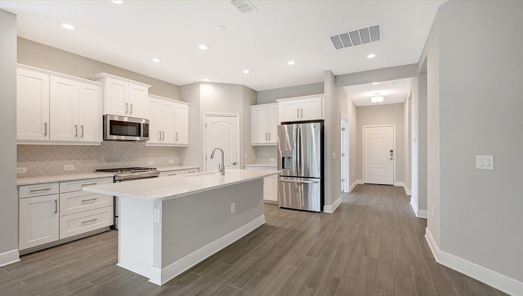 Furnished interior view inside a new home in Boca Royale Golf and Country Club at Wellen Park, Englewood (Image 6).
