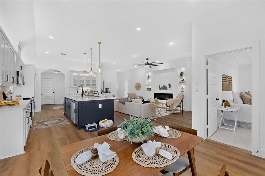 Open concept living area featuring wood-finish flooring