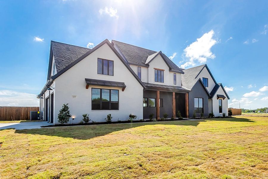 Representative exterior photo of a completed home built from the The Avery by Elmwood Custom Homes in Matthews Farm, Venus, TX (Image 4). Representative exterior photo of a completed home built from the The Avery by Elmwood Custom Homes in Matthews Farm, Venus, TX (Image 4).