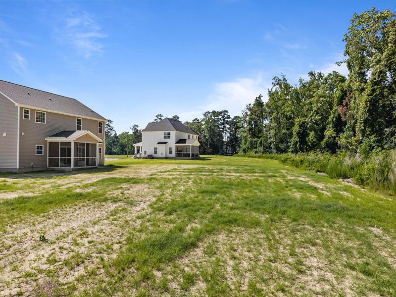 Front exterior of a new home in Laurel Oaks, Greenville, NC, highlighting curb appeal (Image 27). Front exterior of a new home in Laurel Oaks, Greenville, NC, highlighting curb appeal (Image 27).