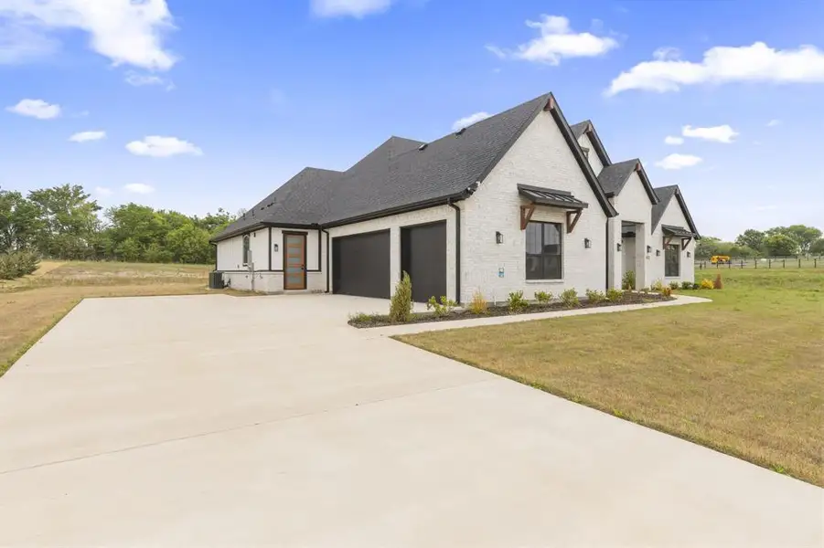 Front exterior of a new home in Capitol Hill, Anna, TX, highlighting curb appeal (Image 25).