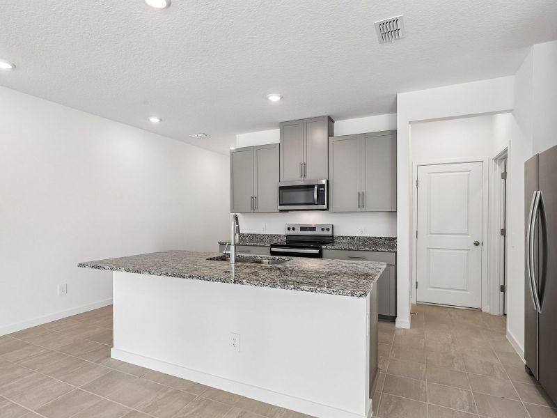 Furnished interior view inside a new home in The District at Oakleaf - The Grove, Middleburg (Image 3).