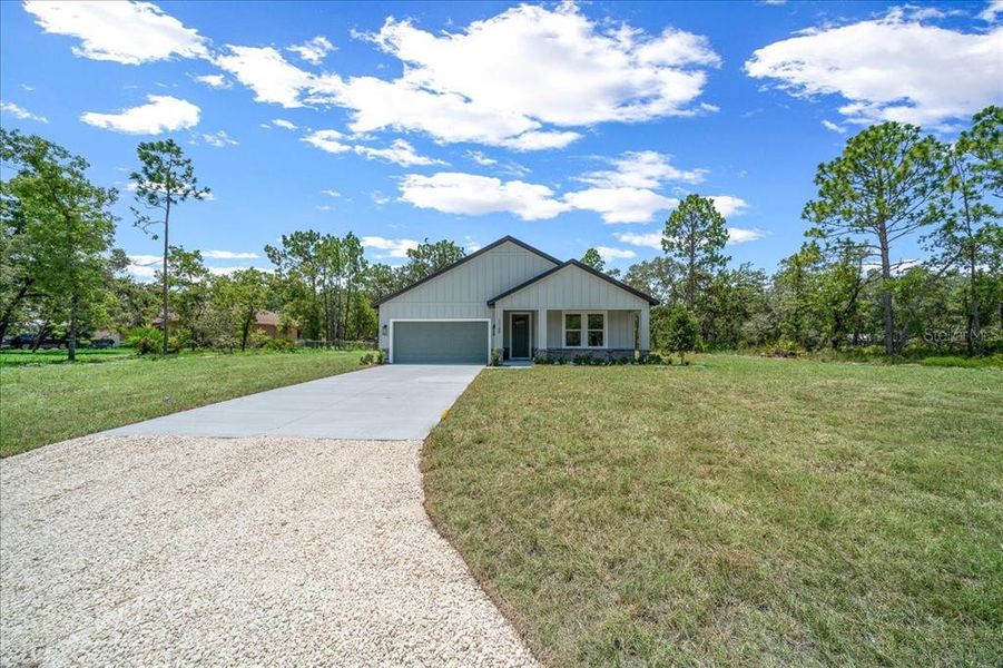 Front exterior of a new home in , Weeki Wachee, FL, highlighting curb appeal (Image 2). Front exterior of a new home in , Weeki Wachee, FL, highlighting curb appeal (Image 2).