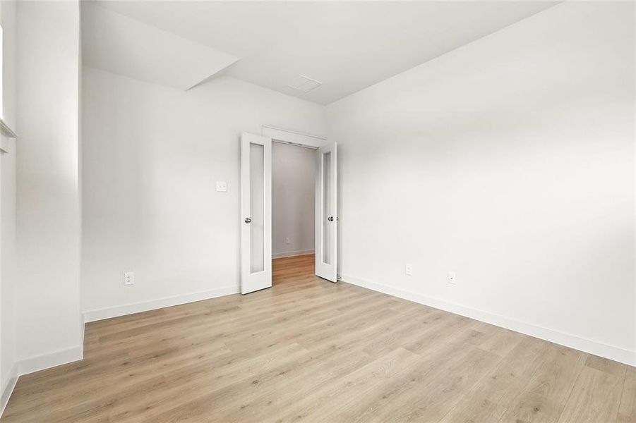 Empty room featuring light wood-type flooring