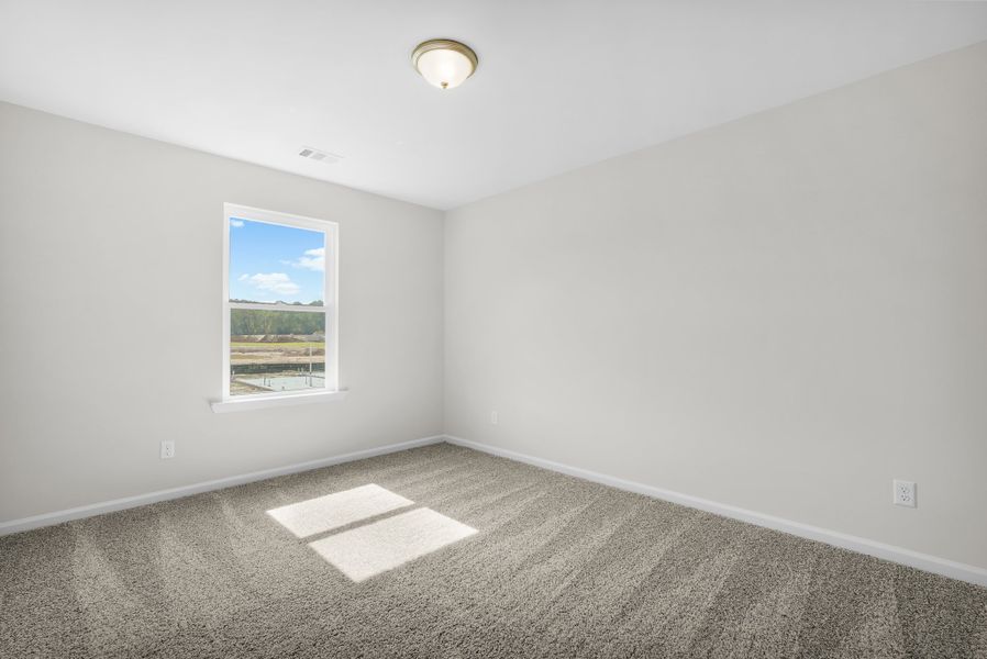 Representative unfurnished interior of a home built from the The Magnolia by Smith Family Homes in Lakeview Pines, Statesboro (Image 59).