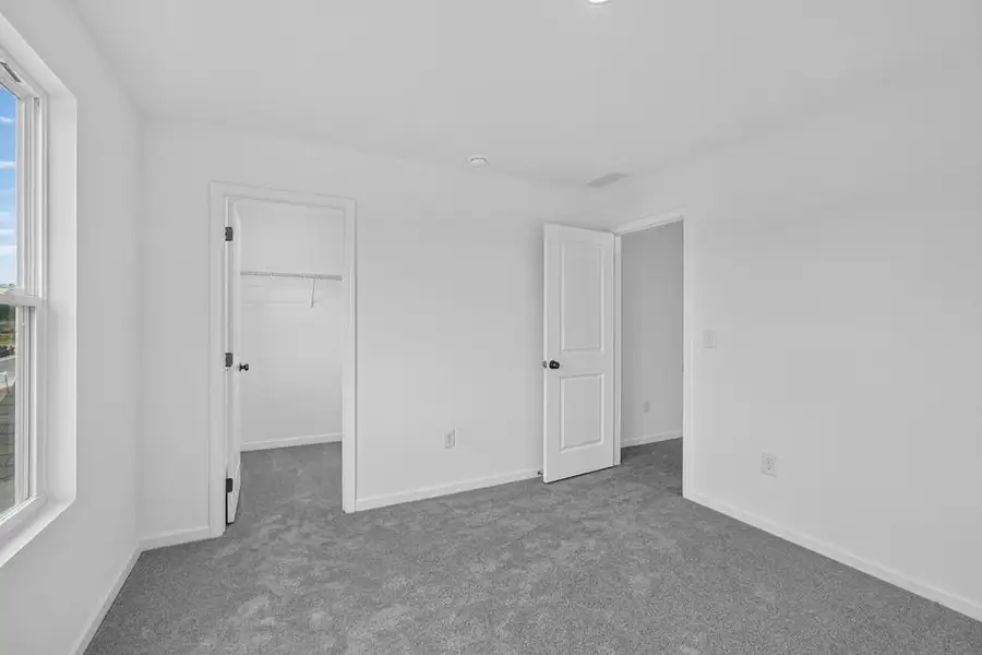Spacious, unfurnished interior of a new home in Weatherfield, Buford (Image 37).